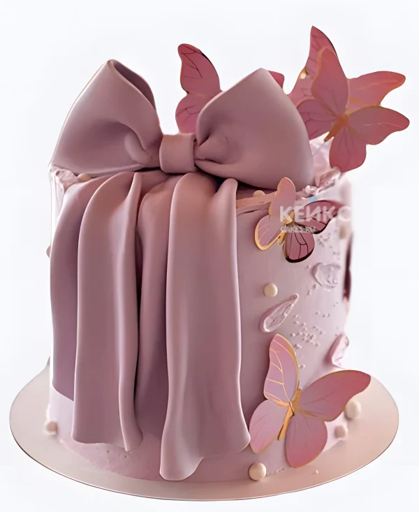 Торт девочке с розовым бантом и бабочками Фото