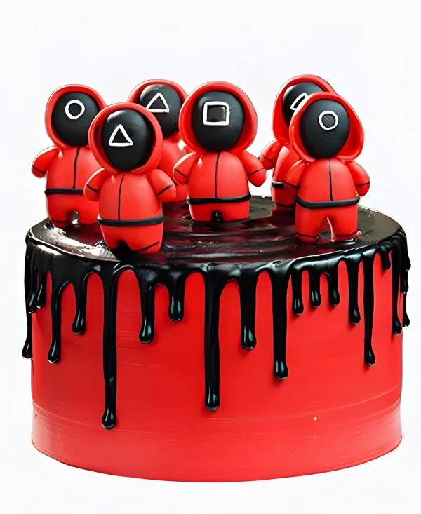 Торт красный с шоколадными подтеками и фигурками Фото