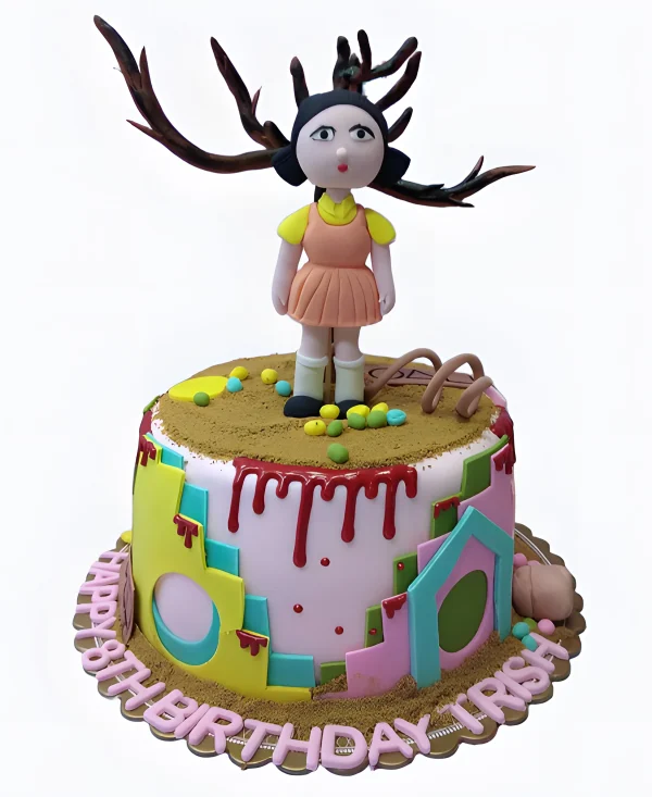 Торт с фигуркой куклы на песке Фото