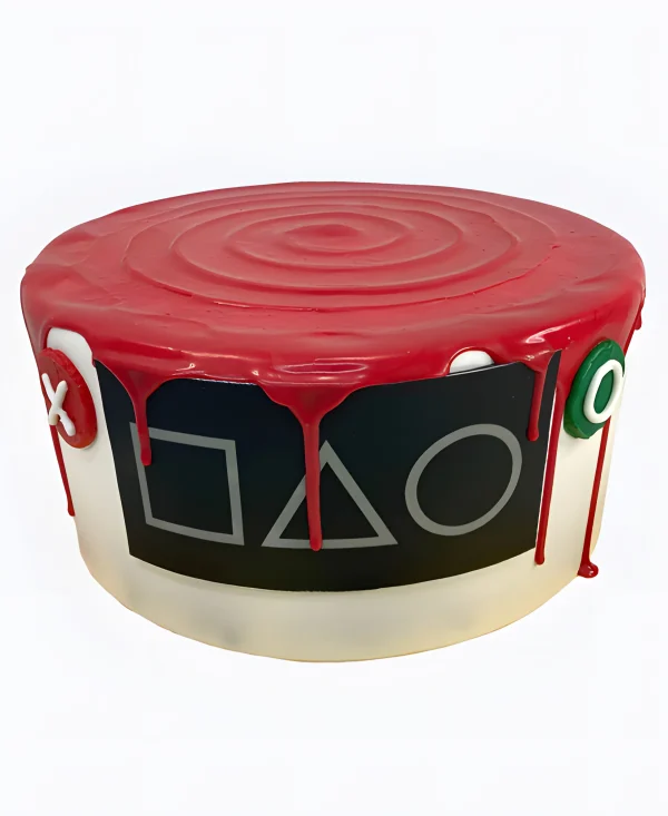 Торт со значками и красными подтеками Фото