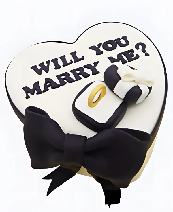 Торт в виде сердца с кольцом и бантом на сватовство Фото