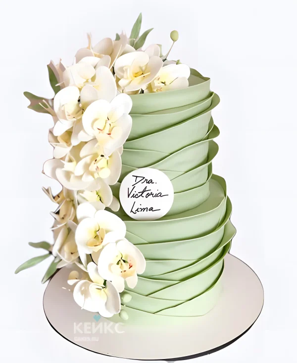 Нежно-зеленый свадебный торт с водопадом из орхидей Фото