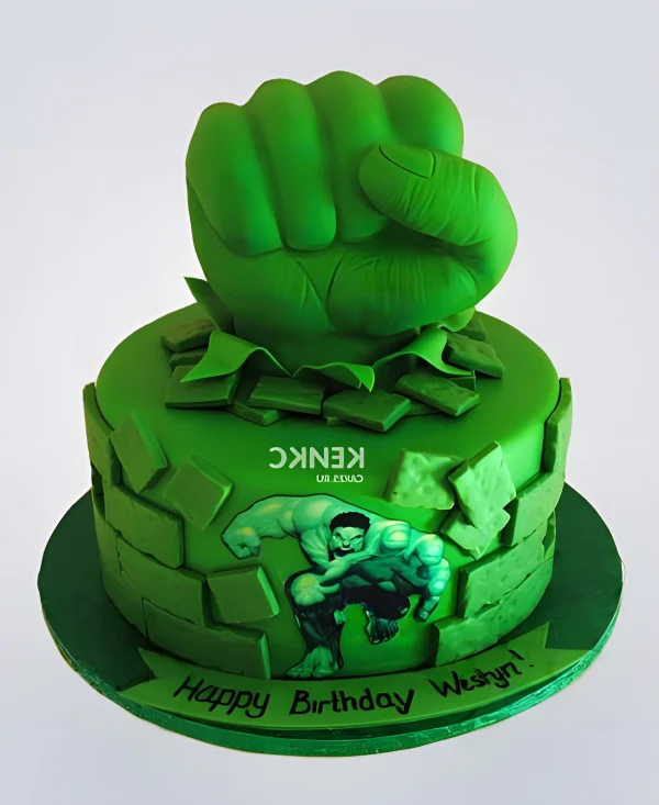 Ярко-зеленый торт Халк с кулаком и кирпичами Фото